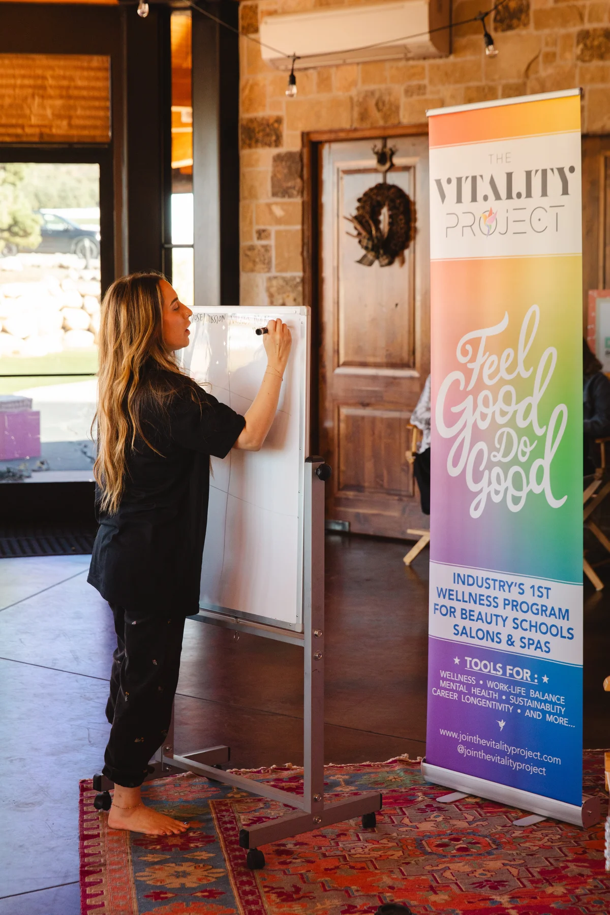 Elizabeth Faye teaching at a whiteboard